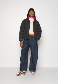 Helly Hansen REVERSIBLE PUFFER - Veste d'hiver - black