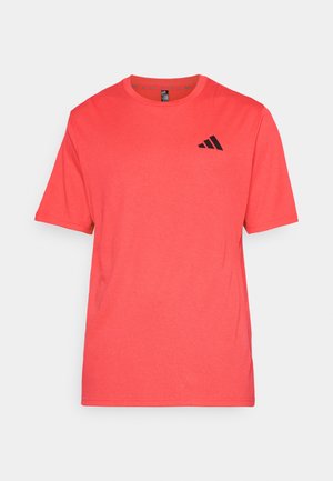 Red athletic t-shirt made of lightweight fabric. Short sleeves, crew neck, features a black Adidas logo on the left chest. Smooth texture.