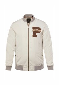 Bomber jacket beige chiaro con zip frontale, polsini a coste e una toppa "P" marrone con la scritta "Heritage" sul lato sinistro del petto.