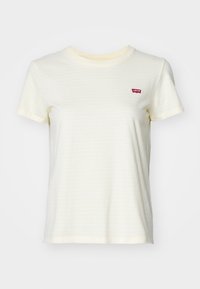 Krótki rękaw, jasnżółta koszulka z cienkimi paskami, okrągłym dekoltem i małym czerwonym logo Levi's na lewej stronie klatki piersiowej. Materiał bawełniany.