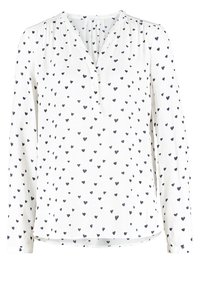 Blouse blanche à manches longues avec un motif de cœurs bleus marine éparpillés et une courte patte de boutonnage en V.