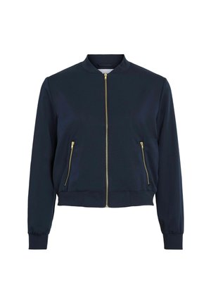 Marine bomberjack gemaakt van soepel weefsel, met een voorkeursrits, twee zijzakken met rits en ribbels aan de mouwen en onderkant. Gouden ritsaccenten.