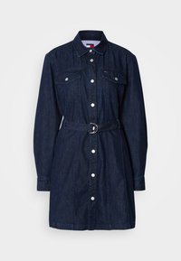Dark denim dress with long sleeves, button front, chest pockets, and a belted waist. Features a classic collar and silver hardware accents.