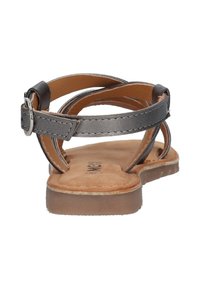 Grijze leren sandalen met kruislings gespen, een gespsluiting en een bruine suede binnenzool. Platte zool, minimalistisch ontwerp en flexibele constructie.