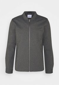Veste zippée gris foncé avec manches longues et petit col, présentée sur un fond clair uni.