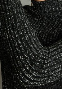 Next Sweter