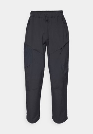 Black cargo pants made from a lightweight, water-resistant material; features elastic waistband, multiple zippered pockets, and tapered legs.