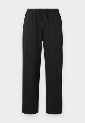 Χαλαρά μαύρα παντελόνια με ελαστική ζώνη μέσης και ρυθμιζόμενο κορδόνι μπροστά, ίσια γραμμή παντελονιού, χωρίς εμφανείς τσέπες ή σχέδια.