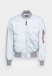 Light blue bomber jacket with a glossy finish, gray ribbed cuffs and hem, full zipper, and a utility pocket with red label detail.