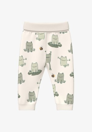Pantalon pour bébé couleur crème orné de grenouilles vertes souriantes et de petites abeilles, avec une large ceinture et des poignets aux chevilles.