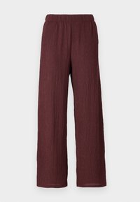 Burgundy wide-leg pants with a textured, crinkled fabric. Features an elastic waistband and falls straight to the ankle.