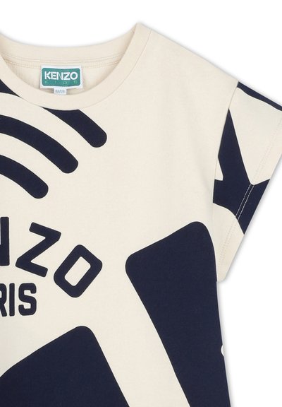 T-shirt en coton crème avec un design graphique bleu marine portant le texte "KENZO PARIS", manches courtes et col rond.