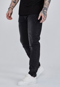 DISTRESSED - Jeans straight leg - washed black