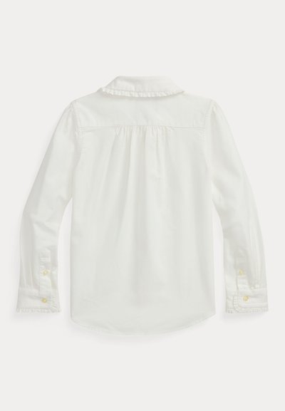 Balta ilgomis rankovėmis palaidinė su raukšlėtu apykakle, mygtukais prie rankovių ir susiraukšlėtu nugara. Pagaminta iš glotnaus audinio su švariu dizainu.