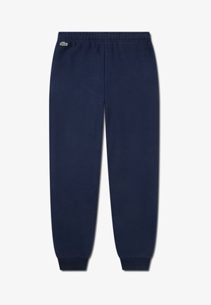 Marineblauwe joggingbroek van katoen, met een elastische tailleband, geribbelde boorden en een klein Lacoste-logo aan de linker bovenzijde.