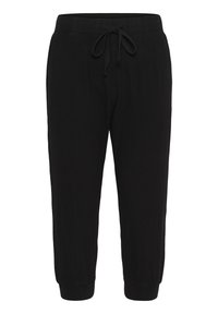 Czarne spodnie dresowe wykonane z miękkiego materiału, z elastycznym paskiem w talii i regulowanym sznurkiem. Dopasowane ściągacze przy kostkach.