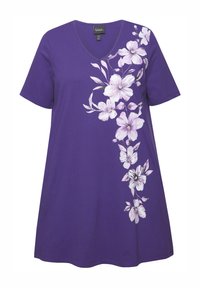Lila bomulls T-shirt med V-hals och korta ärmar, prydd med vit blommönster på vänster sida. Lös passform, mjuk textur.