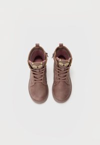 Brown leather ankle boots with laces, side zipper, and a fox design on the tongue; textured finish and padded interior for comfort.