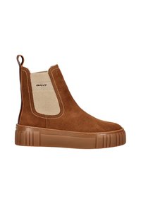 Braune Wildleder Chelsea-Stiefel mit einem hellbeigen elastischen Seiteneinsatz, einer strukturierten, tanfarbenen Sohle und einem Zugband hinten.