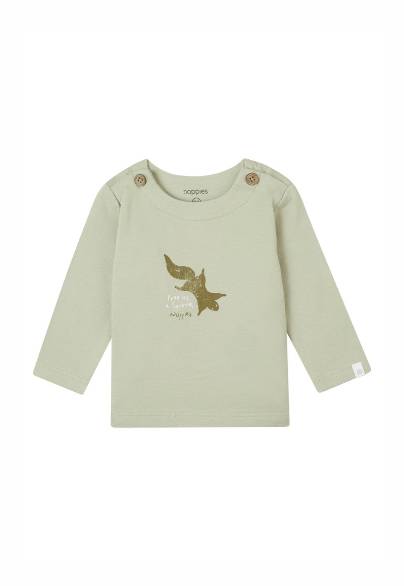 Lichtgroene langemouwen shirt gemaakt van katoen. Beschikt over houten knopen op de schouder en een gouden eekhoornafbeelding met tekst eronder.