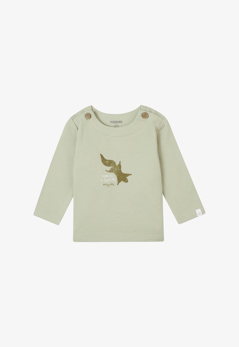 Jasnozielona koszula z długim rękawem wykonana z bawełny. Posiada drewniane guziki na ramieniu oraz złotą grafikę wiewiórki z tekstem poniżej.