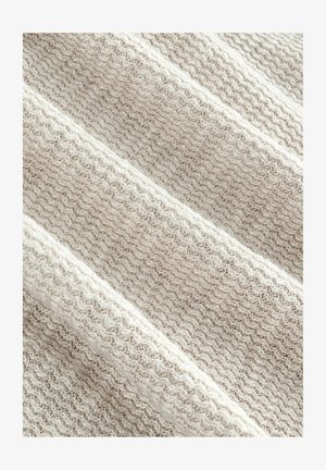 Kihini beež kangas laineteemaga, millel on pehme, kudumise välimus. Materjal on kerge ja sellel on kerge läige.