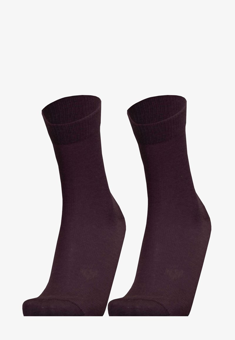 Dunkelviolette Baumwollsocken mit geripptem Muster, in mittlerer Wadenlänge und nahtlosem Zehenbereich. Schlichtes Design ohne sichtbare Muster oder Akzente.