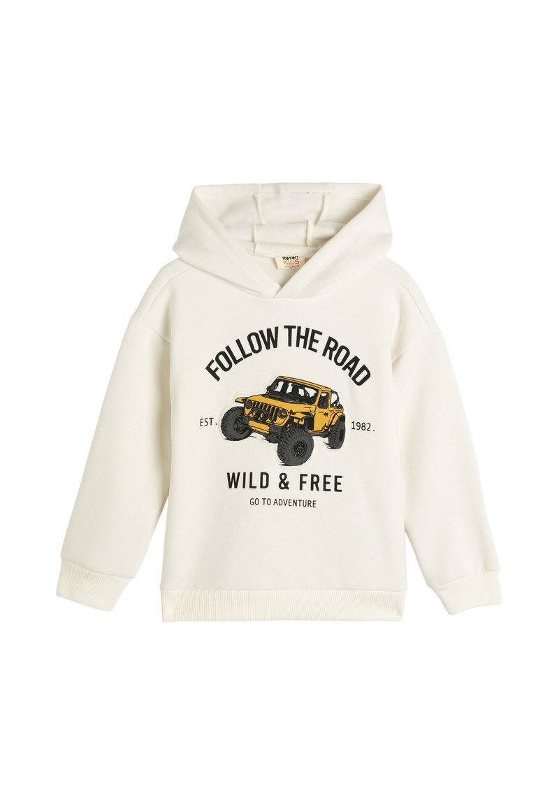 Kremowy bawełniany hoodie z grafiką żółtego pojazdu terenowego oraz napisem "ŚLEDŹ DROGĘ DZIKIE I WOLNE" w kolorze czarnym.