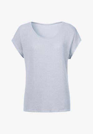 Top azzurro chiaro a maniche corte realizzato in un tessuto testurizzato e traspirante, con scollatura rotonda e vestibilità ampia. Cuciture minime e senza motivi.