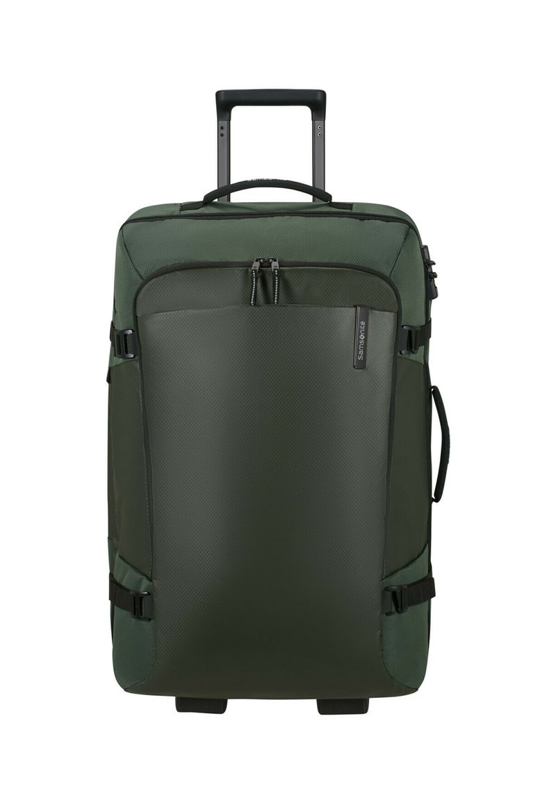 Rolkoffer van donkergroen nylon, met een gestructureerd voorpaneel, dubbele ritscompartimenten, stevige handgreep en zijbanden voor extra veiligheid.