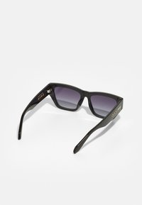 Black rectangular sunglasses with gradient dark lenses, thick frames, and metal accents on the temples. Features a glossy finish.
