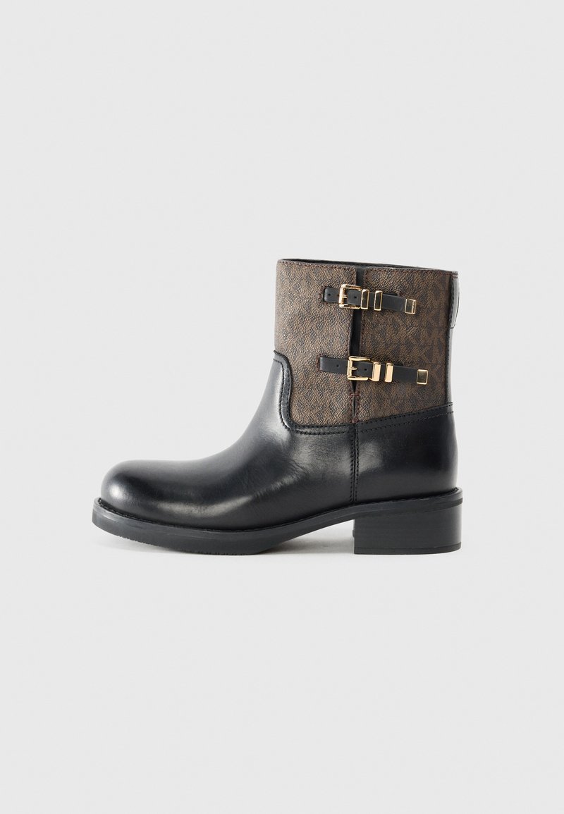 Black leather ankle boot with a patterned brown upper, featuring two gold-tone buckles and a low, sturdy heel. Textured surface detail.