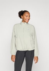 New Balance ATHLETICS PACKABLE JACKET - Vodootporna jakna - garter snake