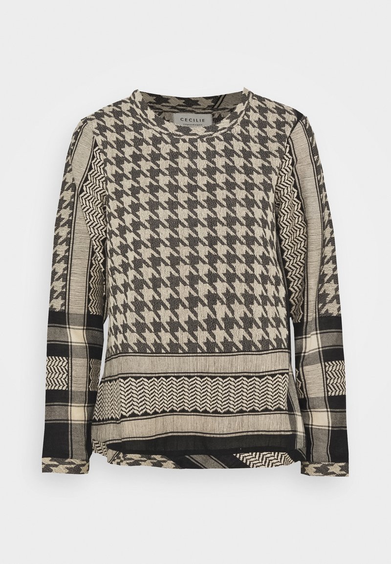 Top a maniche lunghe in tessuto testurizzato con motivo a pied de poule e zigzag in nero e beige. Collo rotondo, vestibilità ampia e fessure laterali.