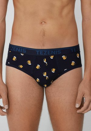 Herrenunterwäsche aus navyblauem Baumwollstoff mit einem Aufdruck von gelben Bierkrügen. Elastischer Bund mit "TEZENIS"-Markenlogo. Klassische Passform.