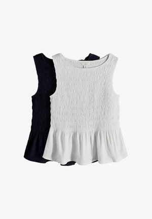 Deux hauts sans manches, un blanc et un noir, avec des corsages smockés et des ourlets à basques volantées, présentés à plat sur un fond blanc.