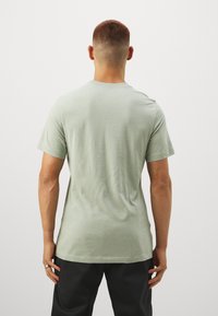 Nike Performance TEE SLUB - Camiseta deportiva - jade horizon