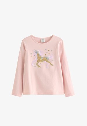 Lyserød langærmet skjorte med en gylden og lyserød paliet-unicorn samt små stjerne-lignende former foran.