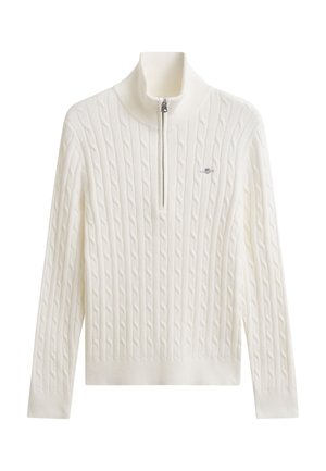 Pull-over blanc en maille torsadée avec une fermeture éclair quart de zip et un col montant, avec un petit logo brodé sur la poitrine.