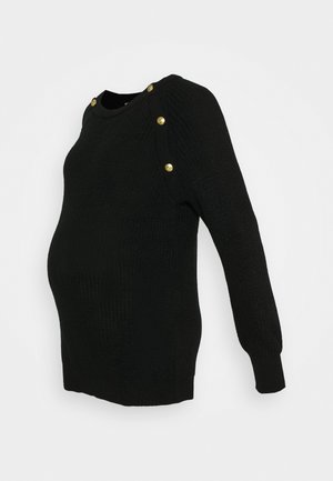 Pull de maternité noir en maille avec manches longues, encolure ronde et boutons dorés sur les épaules, présentant une silhouette ajustée.