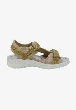Beige sandals with a structured mesh design, featuring yellow and blue patterned straps. Thick white rubber sole for comfort and support.