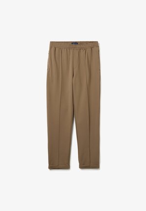Pantalon marron à taille élastique avec une texture lisse, présentant des poches latérales et un design de jambe fuselée. Aucun motif ou accent visible.