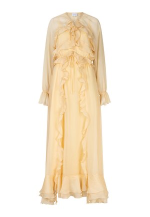 Longue robe jaune en tissu léger, avec détails à volants, taille coulissée et manches longues avec poignets à volants.