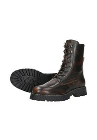 Bruine leren veterschoenen met een robuuste zool, voorzien van opvallende stiksels, metalen oogjes en een hoog enkelontwerp.