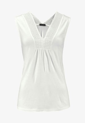 Baltas bebluovis marškinėliai su V formos iškirpte, turintys tekstūruotų nėrinių akcentų prie iškirptės ir suplėnuotą liemenį, užtikrinantį laisvą prigludimą.