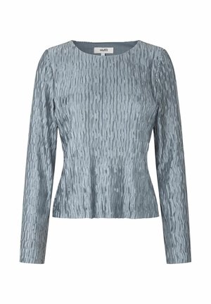 Top largo de manga larga texturizado en azul con un escote redondo. La tela tiene un patrón ondulado y una silueta ligeramente ajustada.