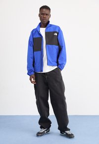 The North Face EASY WIND TRACK JACKET - Suvejakk - blue/black