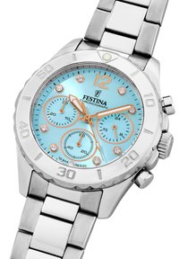 Festina chronograph laikrodis su nerūdijančio plieno juosta, šviesiai mėlynas ciferblatas, trys subciferblatai ir kristaliniai žymekliai. Apdailoje sidabrinis rėmelis ir koronek.