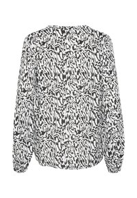 Blouse à motifs noir et blanc avec des manches longues, un col rond et des poignets à volants. Présente un design abstrait ondulé et une texture douce.