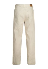 Beige denim trousers with a straight fit, featuring two back pockets and a leather patch at the waistband. Smooth texture and minimal detailing.